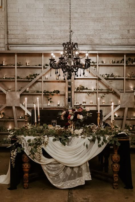 This industrial wedding venue in downtown Phoenix has been steadily gaining momentum since its grand opening, and we can certainly see why! The Icehouse sets the stage for moody wedding ceremonies perfecty with its exposed brick and open air structure. McKenna and Nick knew this was the only spot for them, and the result is a black + burgundy wedding with a dramatic twist on romantic details from start to finish. Head over to Ruffled now to see the full gallery AND the epic denim bridal jacket Black Wedding Head Table, Moody Wedding Sweetheart Table, Dark Romantic Sweetheart Table, Dark And Moody Sweetheart Table, Moody Sweetheart Table Wedding, Gothic Sweetheart Table, Moody October Wedding, Moody Head Table, Moody Sweetheart Table