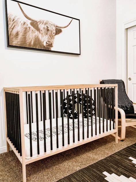 #nursery #ikeanursery #nurserydecor #babyroom Black And Wood Nursery, Ikea Crib Hack, Nursery Wall Decor Ideas, Crib Makeover, Ikea Sniglar Crib, Painting A Crib, Ikea Crib, Ikea Nursery Hack, Modern Nurseries