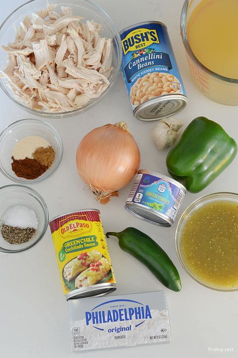 Ingredients for a green chili chicken soup including shredded chicken, green chiles, enchilada sauce, salsa verde, jalapeno, cream cheese, white kidney beans and more! Green Chilli Chicken Enchilada Soup, Chili With Green Peppers, Green Enchilada Chicken Soup Stove Top, Chicken Green Chili Soup, Green Chilli Chicken Enchiladas, Green Chicken Soup, Green Chicken Enchilada Soup, Chili Chicken Soup, Green Chili Chicken Soup