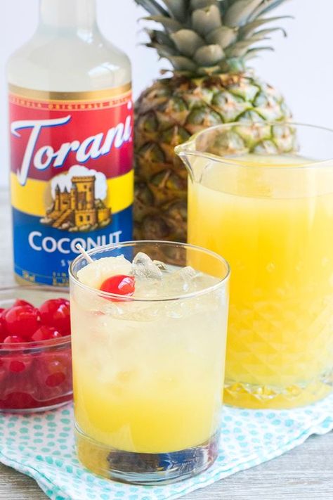 Pina Colada Rum Punch made with Torani Coconut Syrup. Serve this fan favorite cocktail for brunch (or any other time that seems right!) this Spring and Summer. It'll make you feel like you're on vacation - ignore the kids in the background Alcohol Punch, Torani Syrup Recipes, Torani Recipes, Pina Colada Rum, Sugar Free Coffee Syrup, Italian Sodas, Bread Booze Bacon, Torani Syrup, Lemon Juice Uses