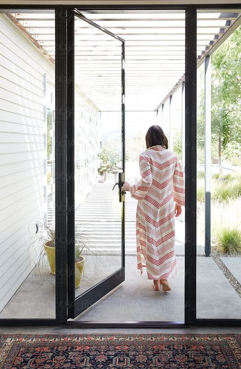 Woman Walking Out Door Of Modern Design Home Download this high-resolution stock photo by Trinette Reed from Stocksy United. Front Door Design Modern, Hillcountry Texas, House Entrance Doors, Glass Entrance Doors, Glass Door Design, Best Front Doors, Modern Entrance, Modern Front Door, Design Door