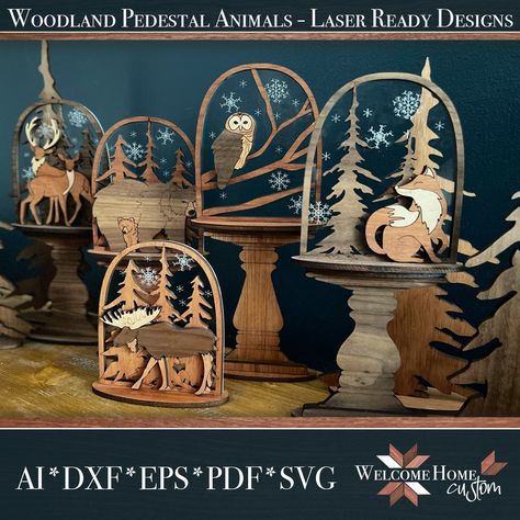 Bring winter magic into any room with our elegant Woodland Animals on Faux Cloche on Pedestal set. A laser cut file design ensures a perfect cut, with woodland wood cut animals, trees and a faux cloche nestled upon a pedestal to create a timeless and tasteful scene. Perfect for personal or small business commercial purposes, this sophisticated set adds a touch of class to any space. Files are formatted as AI, DXF, EPS, PDF, and SVG Files come in 19 different slot sizes to make things a little ea Diy Laser Cut, Laser Cut Wood Crafts, Cut Animals, Marketing Photos, Winter Magic, Woodland Animal, Wood Gifts, Woodland Creatures, Wood Patterns