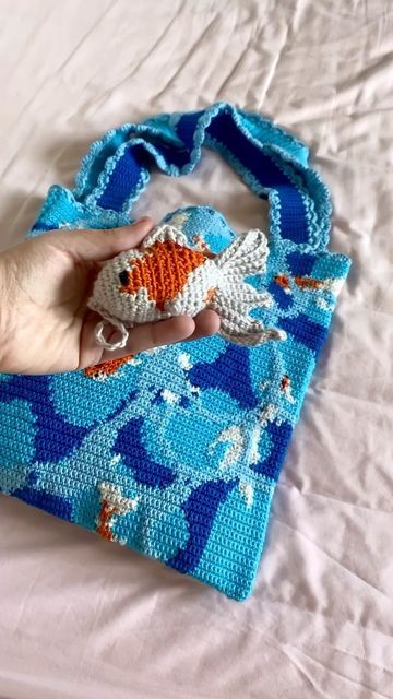 ✿ Alice ✿ on Instagram: "Created a little friend to add to my Garden Pond Tote 🐟 (fish pattern by @sweetsofties ) . . . . . #crochet #crochetinspiration #crochetbag #totebag #crochetfashion #wearableart #slowfashion #handmadeuk #tapestrycrochet #crochetfish" Crochet Pond, Free Koi Fish Crochet Pattern, Crochet Fish Bag Holder, Crochet Goldfish Bag, Crochet Fish Bag, Crochet Ocean Bag, Fish Crochet Pattern, Fish Crochet, Crochet Fish Patterns