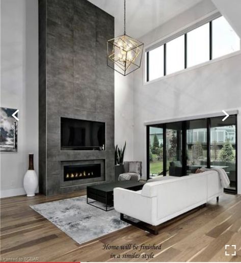 Modern Floor Transitions, High Ceiling Chimney Ideas, Bedroom With High Windows, Modern Living Room With Fireplace And Tv, Tall Fireplace Design, Modern Great Room Fireplace, Tall Fireplace Wall High Ceilings Modern, Modern Floor To Ceiling Fireplace, Modern Chimney Ideas Living Rooms