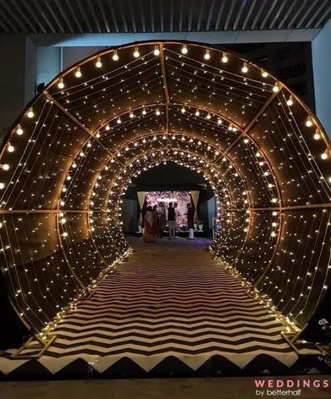 Grand March Entrance Ideas Prom, Party Plot Entry Design, Sangeet Stage Decor Indoor, Entrance Tunnel Wedding, Event Entry Gate Design, Sangeet Theme Ideas, Sangeet Decoration Night Indoor, Sangeet Setup, Event Entrance Design