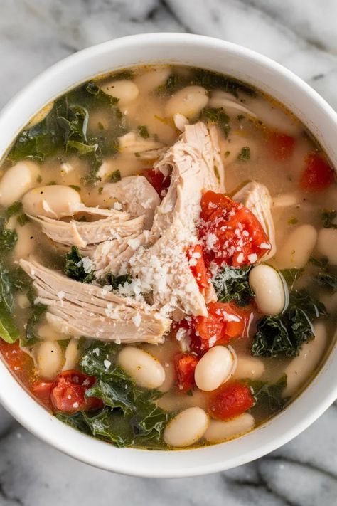 A photo of a  Tuscan Chicken White Bean Soup a winter chicken soup Soup For Two Healthy, Chicken Bean Soup Recipes, Longevity Soup, Chicken And Bean Soup, White Bean Chicken Soup, Creamy White Beans, Chicken Soup Recipes Homemade, Health Soup, White Bean Recipes