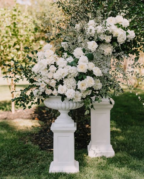 An elegant classic ceremony set-up at Rosemont, featuring stunning urn florals overflowing with roses, hydrangeas, and delphinium. A floral runner seamlessly connects the urns, creating the illusion of a floral arbor 🍃🍃🍃  @weddingsofdesire @rosemont_weddings_events @danellebohane @nataliedrumcelebrant #bridetobe2024 #flowersstgermain #weddingflorist #springwedding #classicbride #melbourneflorist #romanticwedding #melbournewedding #outdoorceremony #europeaninspired #europe #gardenwedding ... Floral Urns Wedding, White Hydrangeas Wedding, Vintage Fairytale Wedding, Classic Wedding Centerpieces, Florist Inspiration, Bordeaux Wedding, White Hydrangea Wedding, Floral Arbor, White Wedding Ceremony