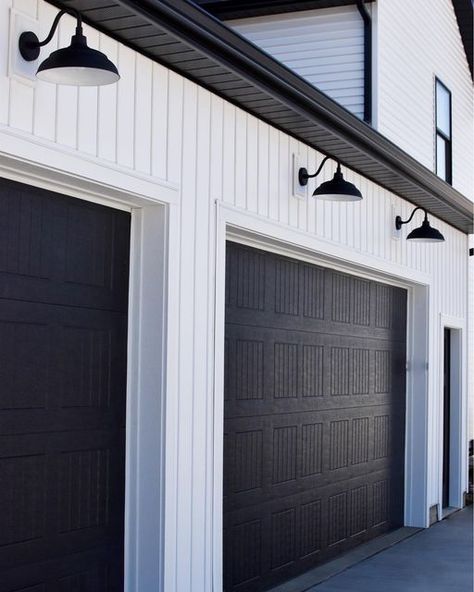 Amanda Stein on Instagram: "When we decided we were going to build a modern farmhouse, these gooseneck lights above our garage doors were a must! I love coming home everyday and seeing them 😍 http://liketk.it/3bc51 #liketkit @liketoknow.it #StayHomeWithLTK #LTKhome #LTKfamily @liketoknow.it.home @liketoknow.it.family Download the LIKEtoKNOW.it shopping app to shop this pic via screenshot . . #farmhouse #modern #modernfarmhouse #modernfarmhouseexterior #exteriordesign #exterior #exteriorsofinsta Lights Above Windows, Black Garage Door, Black Garage, Farmhouse Garage, Farmhouse Exterior Design, Garage Door Design, Farmhouse Remodel, Casas Coloniales, Modern Farmhouse Exterior