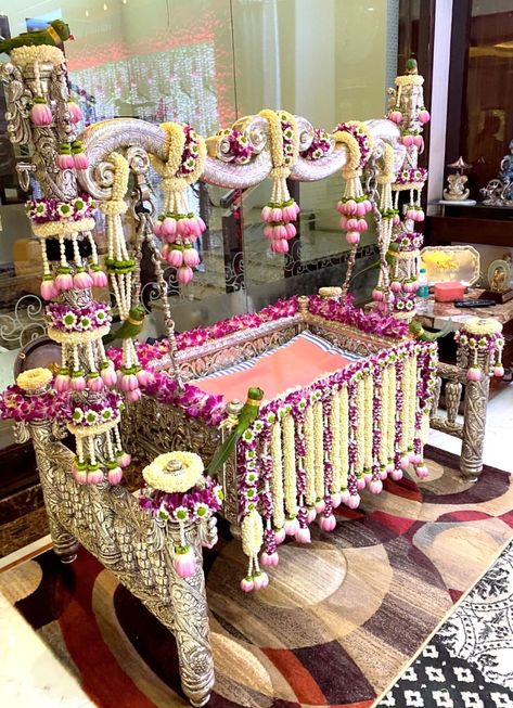 Beautiful Cradle decor for a Cradle Ceremony. #cradleceremony #cradledecor #floraldecor #indiandecor #traditionaldecor Namakaranam Decoration, Uyyala Function, Cradle Ceremony Decorations, Photoshop Glow, Baby Cradles, Cradle Decoration, Indian Baby Shower Decorations, Marigold Wedding, Pregnancy Preparation