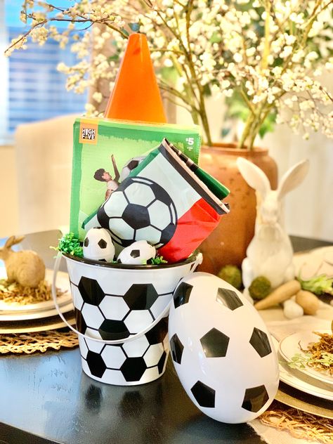 Such a fun basket for a soccer lover. It contains a large over size (beach ball style) soccer ball from FIVE BELOW, a FIFA 2022 string backpack, and 3 set of cones from the dollartree. The bucket and soccer eggs also from the dollartree. Soccer Easter Basket Ideas, Soccer Easter Basket, Easter Basket Themes, String Backpack, Fifa 2022, Easter Basket Ideas, Five Below, Beach Ball, Over Size