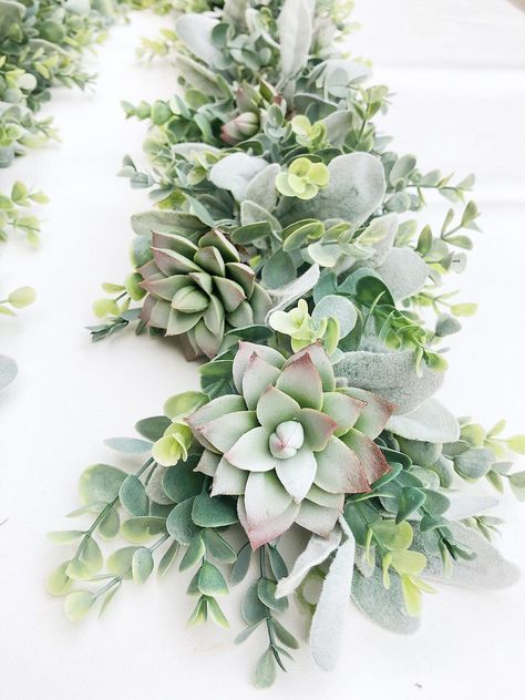 Drape this succulent garland around your wedding welcome sign or use as a table centerpiece. Mantle Greenery, Garland For Table, Garland For Mantle, Eucalyptus Wedding Decor, Garland Flower, Leaves Garland, Garland Decoration, Succulent Centerpieces, Rustic Wedding Decorations