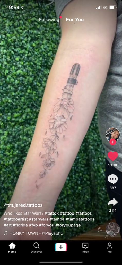 Lightsaber With Flowers Tattoo, Lightsaber Flower Tattoo, Feminine Star Wars Tattoo, Lightsaber Tattoo, Tattoo Over Scar, Lightsaber Hilt, Star Wars Tattoo, Ink Ideas, Body Piercings