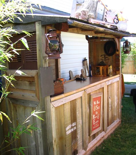 Continuing with my Adventureland theme in my backyard, I created this 'tiki' bar and deck area. I borrowed heavily from the Indiana Jones ride queue of Disneyland... Tiki Bar Plans, Deck Bars, Backyard Tiki Bar, Rustic Deck, Deck Bar, Bar Shed, Tiki Bars, Outside Bars, Bar Plans