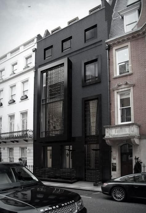 black-painted-building-facade - Home Decorating Trends - Homedit Black Houses, Mayfair London, Lots Of Windows, Design Exterior, Black Ties, Building Facade, Architecture Exterior, Design Strategy, Black Exterior