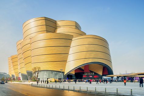 indoor movie park by stufish boasts bold clustered forms - designboom | architecture Clustered Architecture, Architecture 101, Timber Cladding, Arch Daily, Movie Themes, House Architecture Design, Leaning Tower Of Pisa, Water Features, Theme Park