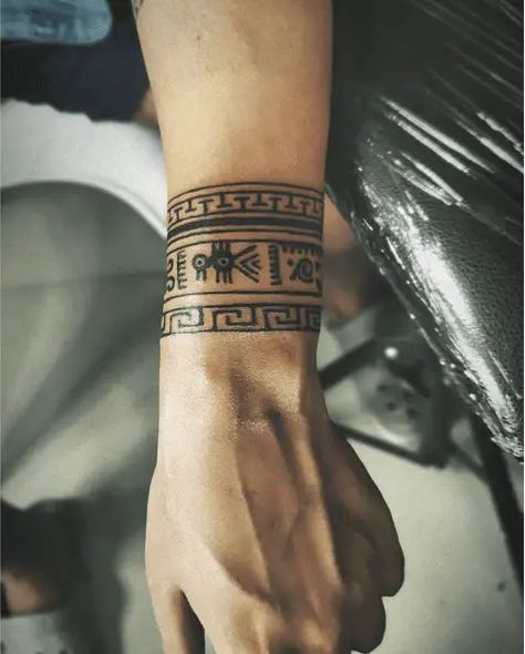 Tattoos Pulseras, Hieroglyphics Tattoo, Feather Tattoo Wrist, Ankle Band Tattoo, Inner Wrist Tattoos, Wrist Band Tattoo, Wrist Tattoo Cover Up, Tattoo Band, Mayan Tattoos