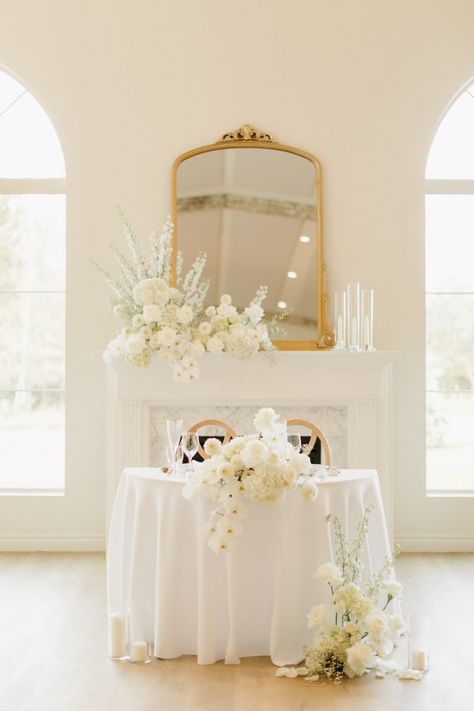 Wedding sweetheart table of your ✨dreams ✨ We LOVE this table for two in front of our cozy fireplace. #WeddingSweetheartTable #DreamWedding #CozyFireplace #IntimateWedding #RomanticSetting #WeddingInspiration #WeddingVibes #WeddingDecor #WeddingIdeas #WeddingGoals Photo by Carissa Marie Photography Sweetheart Table With Fireplace, Sweetheart Table Wedding Indoor, Sweetheart Table Fireplace, Minimal Sweetheart Table Wedding, Sweetheart Table Wedding Fireplace, Unique Sweetheart Table Ideas, Rectangle Sweetheart Table Wedding, Sweetheart Table Round, Sweetheart Table Wedding Elegant