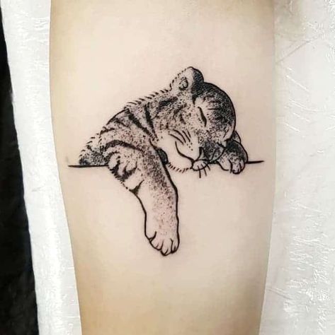 A cute baby lion tattoo for Leo moms by @milainktattoo - Unique Leo tattoos for women -OurMindfulLife.com Leo Son Tattoo, Baby Lion Tattoo, Baby Tiger Tattoo, Tattoo Ideas Leo, Single Needle Tattoo Ideas, Pasta Tattoo, Lion Cub Tattoo, Leo Sign Tattoo, Leo Constellation Tattoo