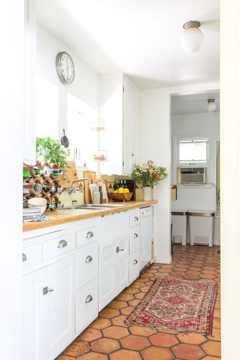 House Tour: A "Boho Beach Bungalow" in California | Apartment Therapy Saltillo Tile Kitchen, Orange Floor, Spanish Kitchen, Bungalow Kitchen, Saltillo Tile, Beach Boho, Beach Bungalows, Boho Kitchen, Kitchen Tile