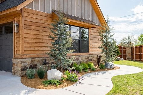 The home exterior features gray stained board and batten, Cedar siding and reclaimed barnwood That's how a real farmhouse is made of! #homeexterior #stainedboardandbatten #Cedarsiding #reclaimedbarnwood Stained Board And Batten, Exterior Wood Siding Colors, Exterior Siding Ideas, Wood Siding Colors, Rustic Cabin Exterior, Real Farmhouse, Log Homes Exterior, Mid Century Modern Farmhouse, Wood Siding Exterior