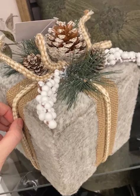 I love seeing new decor at stores like Hobby Lobby, but I often wonder if I’d be able to make most of the decor I see. Naturally, as crafters, we love the challenge! Read on to learn how to make a smaller version of this felt present from Hobby Lobby. Unfortunately, I couldn’t find fur like this one that was in my price range so I went with a felt scarf from Dollar Tree. But this present was the original inspiration. It was extremely difficult to find a larger square gift box that… White Christmas Presents, Gift Boxes For Christmas, Making Gift Boxes, Gift Hacks, Hobby Lobby Christmas, Felt Scarf, Crochet Scarf Pattern, Crochet Scarf Pattern Free, Craft Decorations