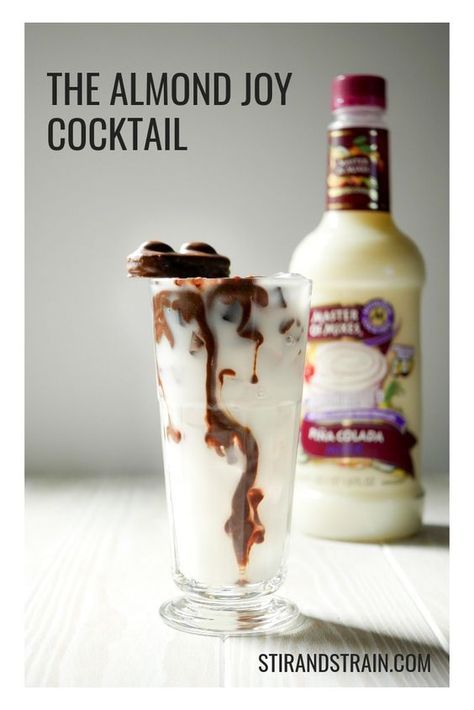 Candy Inspired Cocktails with Master of Mixes! Love an Almond Joy? Try this cocktail with vanilla vodka, almond extract, Piña Colada Mixer and a chocolate syrup float. So good! // stirandstrain.com #stirandstraindrinks #entertaining #cocktails #halloween #masterofmixes #partner Raspberry Mojito, Tom Collins, Vanilla Vodka, Almond Extract, Boozy Drinks, Almond Joy, Vodka Drinks, Fall Cocktails, Vodka Cocktails