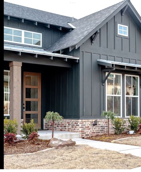 Cabin Siding Colors, Gray And Brown Exterior House Colors, Charcoal Board And Batten Exterior, Brown Exterior House Colors, Siding Ideas Exterior, Deck Railing Ideas, Board And Batten Exterior, Paint Color Ideas, Railing Ideas