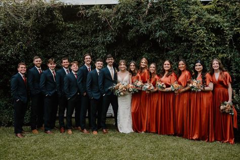 October Fall Wedding Bridal Party Bride Groom Bridesmaids Groomsmen Navy Suits Burnt Orange Dresses Groomsmen Attire Navy Blue And Burnt Orange, October Wedding Suits, Navy Blue And Burnt Orange Wedding Suit, Navy And Rust Bridal Party, Fall Wedding Suits For Men Burnt Orange, Burnt Orange And Navy Wedding Party, Navy Blue Tux With Burnt Orange, Rust Orange Bridesmaid Dresses With Groomsmen, Burnt Orange Bridal Party Groomsmen