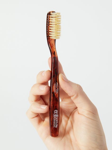 A C.O. Bigelow toothbrush designed with natural boar bristles and a tortoiseshell pattern that look like something out of a Sherlock Holmes film. We love mundane products that look luxe 👏 and 👏 vintage 👏. Co Bigelow, C.o. Bigelow, Toothbrush Design, Bite Beauty, Makeup Mirror With Lights, Teeth Care, Light Makeup, Makeup Mirror, Carrying Case