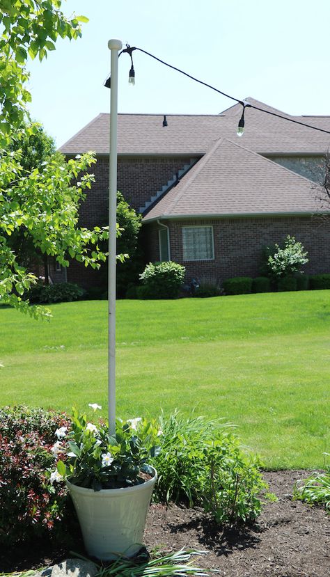 cement pole inside pot to hang lights | Enbrighten Café Lights & DIY Light Pole Planter - Sincerely, Sara D ... Diy Light Pole Planter, Light Pole Planter, Diy Outdoor Lighting, Diy String Lights, Lights Diy, Diy Light, Patio Pots, Light Pole, Backyard Lighting