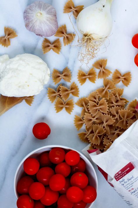 This creamy Tomato Ricotta Pasta is made with burst cherry tomatoes, garlic, and creamy ricotta. Blend it up, toss with your favorite pasta, and garnish with fresh basil. Bonus? Ricotta boosts the nutrition of this dish with some added protein! Ricotta Pasta, Fresh Basil, Cherry Tomatoes, Ricotta, Basil, Cherry, Garlic, Nutrition, Pasta