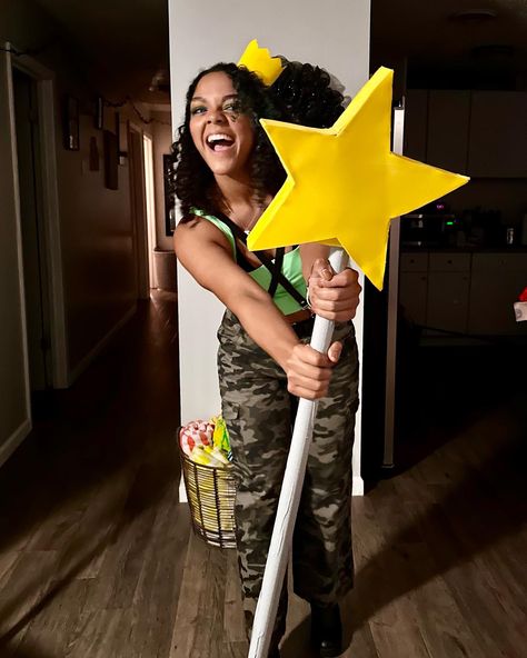 smiling girl with blue contacts wearing camouflage pants and a lime green tank top holding a large fairy wand from the popular tv show, fairly odd parents. she also has on black boots and with a crossed harness over the lime green tank top with a fairy crown on her head. Camo Pants Halloween Costume, Fairy Oddparents Costume, Jorgen Von Strangle, Easy Costumes Women, Fairly Odd Parents Costume, Camo Costume, Nickelodeon Costumes, Halloween Costume Easy, Y2k Costume