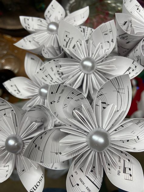 Origami sheet music flowers Music Paper Flowers, Sheet Music Flowers, Music Christmas Ornaments, Origami Sheets, Sheet Music Crafts, Banquet Ideas, Music Christmas, Music Crafts, Music Paper