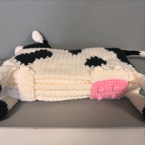 Long-term project requiring over 19 hours of crochet time and 2 hours of pattern research and study. Created a plush cow blanket for snuggling and decorative purposes. Its unique design allows it to fold into the shape of a cow, adding an extra touch of whimsy to any room. Crochet Cow Blanket, Crochet Cow Folding Blanket, Cow Pattern Crochet Blanket, Cow Print Crochet Baby Blanket Pattern, Crochet Cow Granny Square Blanket, Cow, Unique Designs, Crochet, Pattern