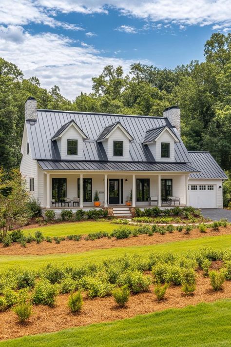 Charming white house with a sleek metal roof and inviting front porch. Homes with sprawling acreage offer more space for both your wildest dreams and that ever-growing collection of garden gnomes. White Metal Siding Exterior, White House Gray Metal Roof, White Metal Siding, Metal Siding Exterior, Houses With Land, Front Porch Homes, Gray Metal Roof, Homes With Land, House With Land