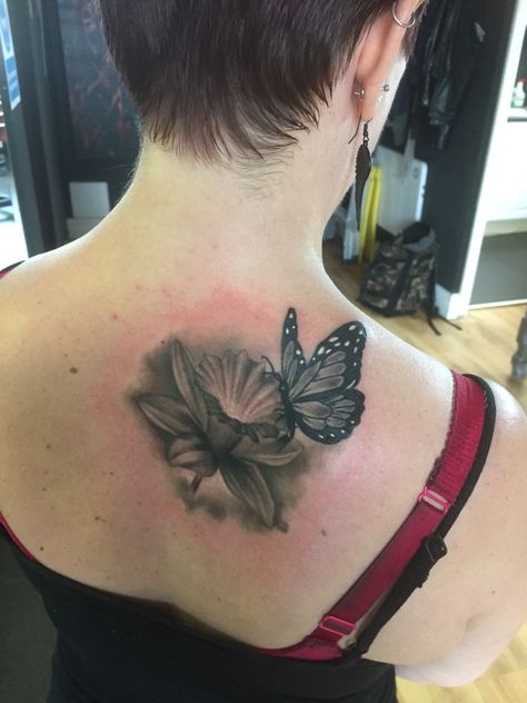 Butterfly and daffodil tattoo - my first tattoo and absolutely love it! Daffodil Butterfly Tattoo, Daffodil And Butterfly Tattoo, Daffodil Flower Tattoo, Daffodil Flower Tattoos, Unique Butterfly Tattoos, Daffodil Tattoo, Favorite Tattoos, Candle Tattoo, Daffodil Flower