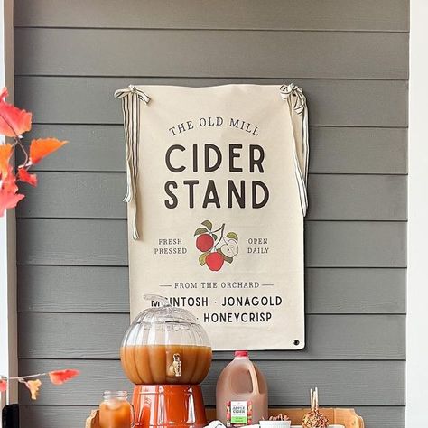 Kati Nairn | Beyond Gray on Instagram: "Cider stands need cider signs 🍂 Comment the word SHOP and I’ll DM you the link to this sign and more. The sign is from @joyfullysaid and it’s canvas so you can roll it up for easy storage. Code BEYOND can be used for a discount. I added my own ribbon to the grommets at the top. This is actually the first cider stand that I’ve ever put together. Also, highly recommend a splash of Caramel Apple Vodka to your cider for Happy Hour. 💁🏼‍♀️" Apple Vodka, Honeycrisp Apples, Apple Cider, Caramel Apples, Cider, Vodka, Caramel, Fall Decor, Rolls