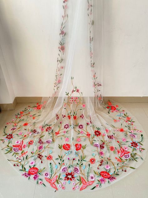 This veil evokes a sense of magic and beauty, emphasizing the vibrant and intricate floral embroidery on your bridal veil. This veil has a width of 108 inches and comes with a separate metallic comb which need to be attached as per your preference. To ensure complete satisfaction with your purchase, we offer you the option to order a sample of our work. The sample is provided on 1 mtr tulle. Bodas Boho Chic, Floral Wedding Veils, Floral Hand Embroidery, Floral Veil, Wedding Veil Accessories, Future Wedding Plans, Dream Wedding Ideas Dresses, Embroidered Wedding, Pastel Wedding