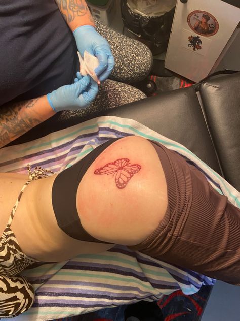 Butterfly Tattoo On Buttcheek, Red Tattoo Thigh, Baddie Butterfly Tattoo, Butterfly Tattoo On Side, Butterfly Buttcheek Tattoo, Black And Red Butterfly Tattoo, Butterfly Hip Tattoo, Red Butterfly Tattoo, Side Stomach Tattoos