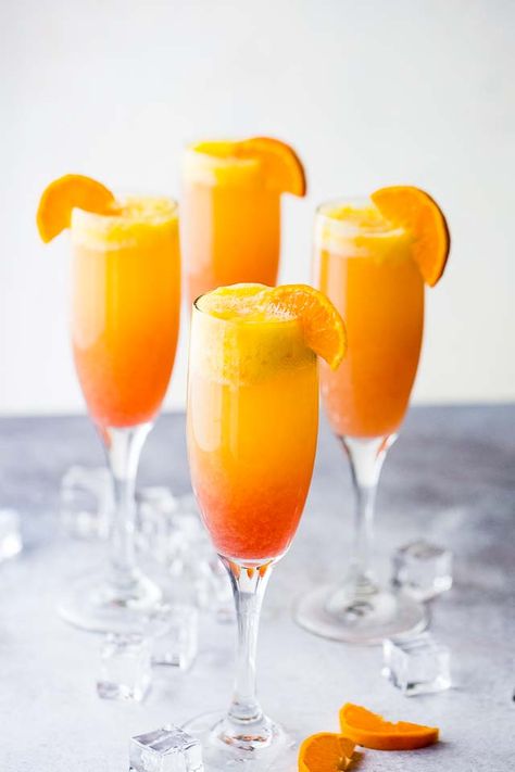 Sunrise Mimosa Recipe - A gorgeous and delicious twist to the classic mimosas prepared with mangos, orange juice, prosecco and liqueur. Sunrise Mimosa, Easy Mimosa, Pomegranate Liqueur, Mango Cocktail, Champagne Punch, Mimosa Recipe, Ina Garten Recipes, Punch Recipe, Party Punch