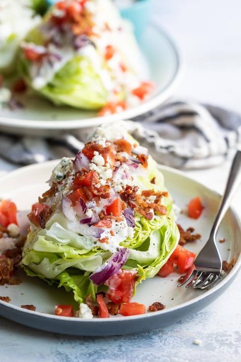 Inspired by the classic steakhouses, this Iceberg Wedge Salad is smothered in creamy blue cheese dressing and topped with bacon, tomatoes, and more blue cheese crumbles. Iceberg Wedge Salad, Iceberg Salad, Wedge Salad Recipes, Lettuce Wedge, Blue Cheese Dressing Recipe, Cabin Food, Wedge Salad, Cheese Wedge, Blue Cheese Dressing