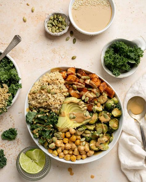 Loaded with grains, veggies, and plant-based protein, this sweet potato chickpea buddha bowl is an easy, quick, and delicious way to pack a ton of nutrition and flavor into a dish! Topped with a thai peanut sauce, it's the perfect week night meal, is great for meal prep, and can be customized to your preference. Sweet Potato Quinoa Bowl, Chickpea Buddha Bowl, Sweet Potato Quinoa, Potato Chickpea, Vegan Mushroom Stroganoff, Thai Peanut Sauce, Vegan Buddha Bowl, Mushroom Stroganoff, Sauteed Kale