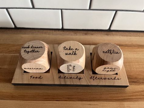 Never struggle to decide what to do for a date night again! Details: Dice are 1 1/2" in size Includes a stand for all 3 dice Wood Dice Crafts, Date Night Dice Diy, Wooden Dice Crafts, Anniversary Crafts For Him, Wooden Anniversary Gifts For Him, Date Gift Ideas, Holiday Wood Signs, Glowforge Crafts, Wood Anniversary Gift For Him