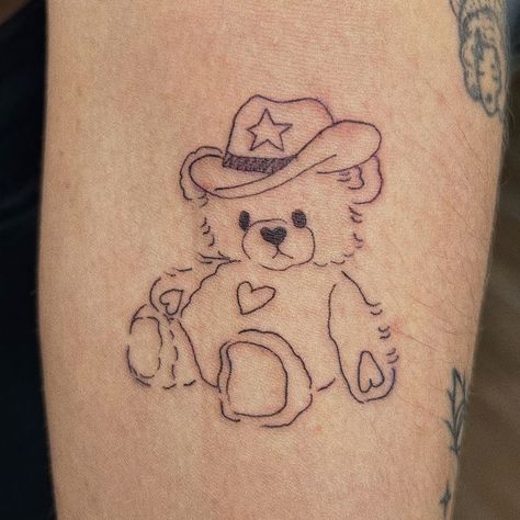 https://instagram.com/emmakashif?igshid=MjkzY2Y1YTY= Teddy Bear Drawing Tattoo, Cowboy Teddy Bear Tattoo, Teddy Bear Tattoo Aesthetic, Bear Tattoo Aesthetic, Stuffed Animal Tattoo Simple, Bear Tattoos Cute, Sweethearts Tattoo, Childhood Stuffed Animal Tattoo, Plushie Tattoo