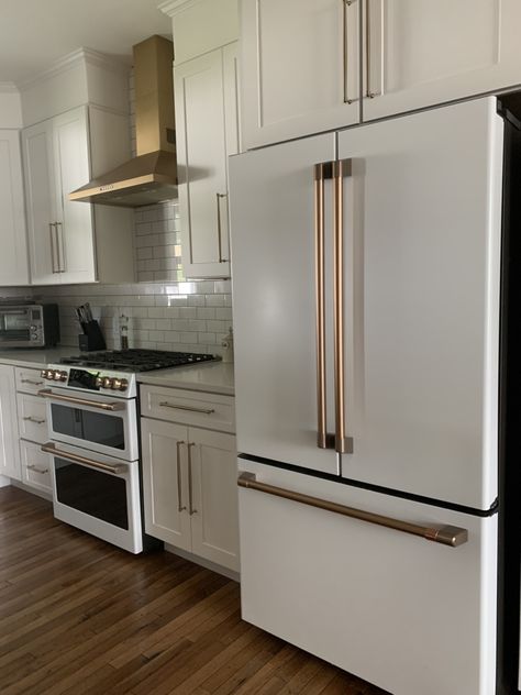 White Kitchen With White Cafe Appliances, Fridge By Stove, Ge Cafe Appliances White, Lg Cafe Appliances Kitchen, Bespoke Fridge Kitchen, Cafe Collection Appliances, Fridge Next To Stove Kitchen, Fridge And Stove On Same Wall, Gold Appliances Kitchen