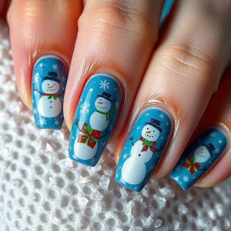 Festive Snowman Nail Polish Art ❄️☃️ Add a frosty charm to your nails with this vibrant snowman nail design! 💙 Featuring a rich blue base adorned with cheerful snowmen, delicate snowflakes ❄️, and festive details like scarves and bows 🎀, Whether you're decking the halls or enjoying a winter wonderland, these nails will keep your style merry and bright! 💅✨ A must-try for nail polish lovers who love bold, festive designs! #NailPolish #NailArt #WinterNails #NailDesign #NailAddict #NailLover Snowman Nail, Snowman Nails, Polish Art, Nail Polish Art, Holiday Nail Art, Xmas Nails, Christmas Magic, Winter Nails, Christmas Nails