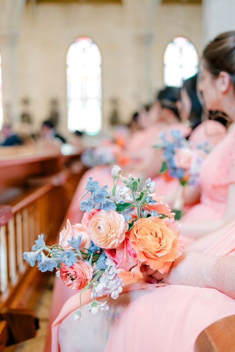 Colorful garden-like bouquet at The Briscoe | Lavender clematis, salmon dahlia, coral dahlia, light blue delphinium, blue muscari, coral peony, coral and apricot ranunculus, miss piggy rose | Photo by: Allison Jeffers Photography | Scarlet Rose Events Coral Pink And Blue Wedding, Apricot Ranunculus, Tulip Bridesmaid Bouquet, Lavender Clematis, Light Blue Delphinium, Bouquet Shapes, Blue Muscari, Coral Dahlia, Coral Bouquet