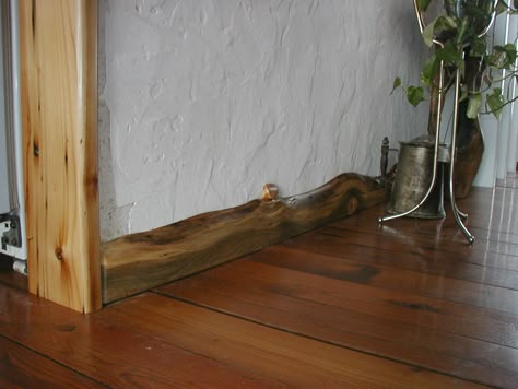 Live Edge Wood Baseboards, Raw Wood Baseboards, Live Edge Baseboard, Unique Baseboard Ideas, Rustic Baseboards, Live Edge Trim, Wood Baseboard, Live Edge Wood, Baseboards