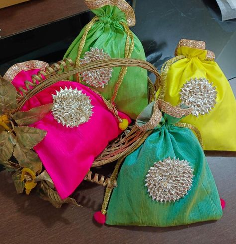 Low range potlis now available price-123/- flat for all Moq: 10 MU8 10 February, Bridal Gift Wrapping Ideas, Potli Bag, Wedding Hands, Silk Bag, Wedding Crafts Diy, Potli Bags, Festive Collection, Handbag Patterns