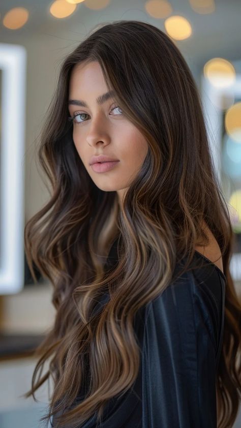 Woman with long, wavy brown hair and a thoughtful expression indoors. Light Brown Hair With Lowlights Balayage, Subtle Ombre For Dark Hair, Balayage To Brunette, Cool Balayage Brunettes, Subtle Balayage Brunette Dark, Brunette Hair With Dimension, Light Brown Highlights On Dark Hair, Subtle Dimensional Brunette, Brunette Hair With Caramel Highlights